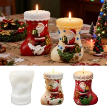 Detail of Santa Claus sock shaped silicone mold and finished embossed resin craft