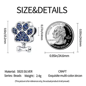 Silver pet paw and bone charm with blue cubic zirconia and size dimensions chart