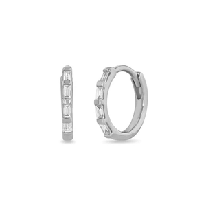 Close-up of silver hoop earrings featuring rectangular clear gemstone settings