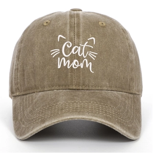 Detail of white Cat Mom embroidery on vintage washed khaki cotton baseball cap