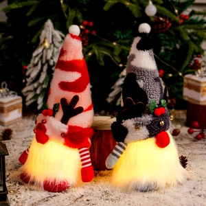 Lighted Christmas Gnomes with antlers on snowy background for holiday home decoration