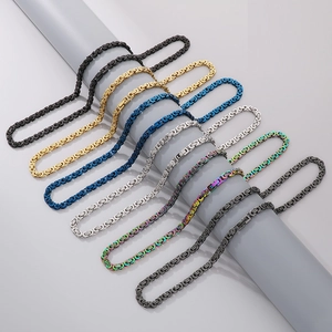 Detail of Byzantine link bracelets in various metallic finishes on a display cylinder