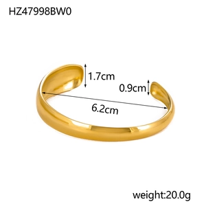 Detailed view of 18K gold plated C-shape wide bangle showing measurements and polished finish