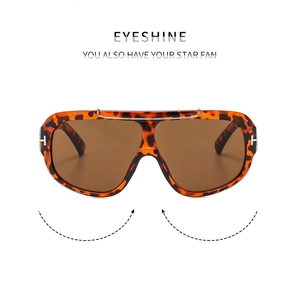 Detail of tortoiseshell pilot sunglasses featuring silver bridge and signature T-hinge