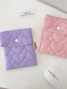 Quilted heart pattern storage pouch in pink and purple with white snap button closure