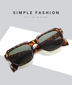Detailed macro view of retro tortoiseshell square sunglasses frame with rice nail accents