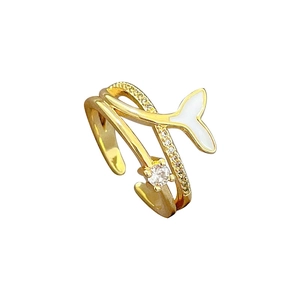 Adjustable gold mermaid tail ring with white enamel and sparkling zircon accents