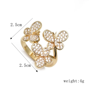 Adjustable gold butterfly ring with micro-paved white zircons and triple butterfly design