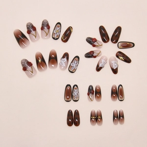 Detail of floral and cherry 3D press-on nails with amber leopard patterns and star accents