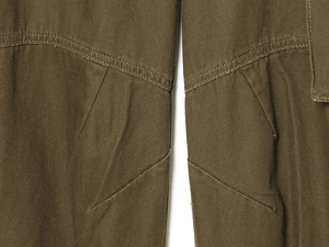 Detail macro view of heavy olive cotton canvas fabric with reinforced stitching