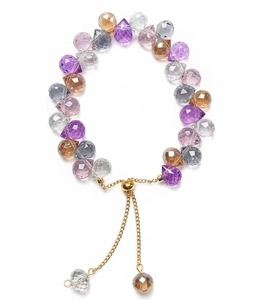 Detail of colorful teardrop crystal bracelet with golden adjustable slider clasp
