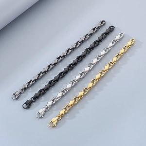 Detailed view of geometric stainless steel link bracelets in black, silver and gold tones