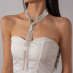 Exaggerated silver metallic tassel necklace with shimmering rhinestone mesh for luxury gala