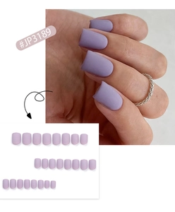Detailed view of short matte lavender purple press-on nails for daily wear manicure