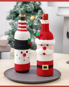 Detailed knitted Santa and snowman wine bottle covers for festive Christmas table decor