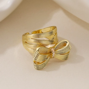Chic 18K gold plated bow ring with pink diamonds and brushed texture for women