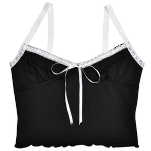 Detail of black camisole featuring white lace trim, bow tie, and ruffled hem design