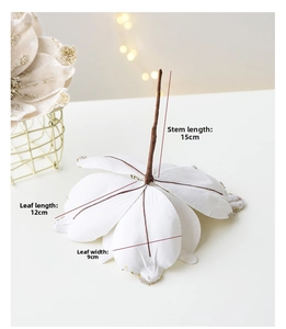 Detail of 25cm white velvet poinsettia showing 15cm stem and 12cm petal size details