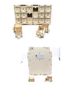 Detail of wooden advent calendar with 24 numbered drawers and back battery compartment