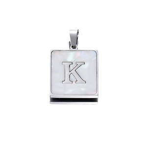 Detail view of 22mm silver square pendant with letter K and white mother of pearl inlay