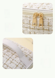 Detail of woven fabric texture with gold threads, metal zippers and PU leather handle