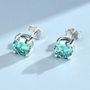 Classic four-prong S925 sterling silver stud earrings with round blue moissanite stones