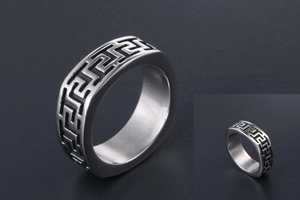 Detailed close-up of retro titanium steel ring with Great Wall meander pattern engraving