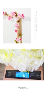 Close-up detail shot of 65g lightweight white artificial flower garland for home decor