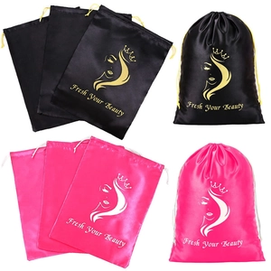 Glossy satin drawstring pouches for jewelry and wigs in black and magenta with logo