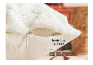 Close-up of invisible zipper detail on white plush Christmas pillow cover with textures