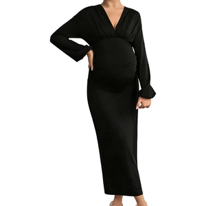 Detail of the V-neckline and elastic pleated texture on the black maternity bodycon dress
