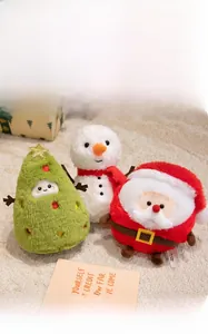 Plush Christmas toy set featuring Santa Claus, a snowman, and a festive tree in a cozy home