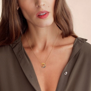 S925 silver sun flower necklace with colorful zircons worn on a model's collarbone