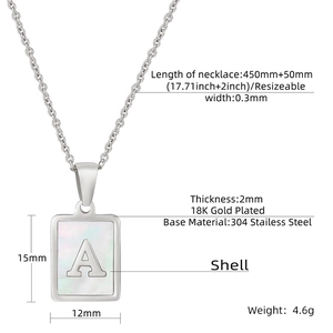 Detailed view of rectangle shell pendant necklace with gold letter A and dimension markings