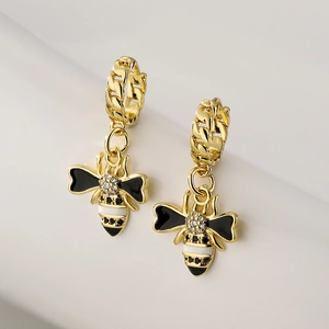 18K gold plated bee drop earrings with black enamel and zircons on a white background
