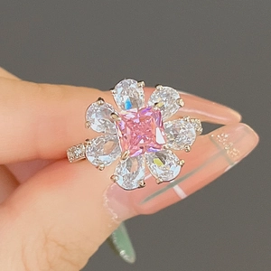 Elegant floral ring with square pink center stone and teardrop petal zircons