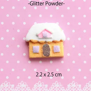 Macro view of 2.2x2.5cm glitter gingerbread house resin charm for DIY phone case crafts