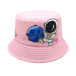 Close-up of pink sun hat featuring cartoon astronaut and planet patterns for kids