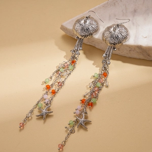 Detailed shot of jellyfish and starfish tassel earrings with colorful glass beads