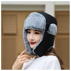 Detailed side view of windproof winter bomber hat with thick earflaps and buckle