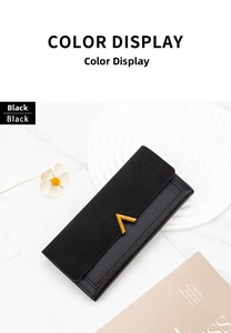 Close-up of black PU leather long wallet with elegant golden V-shaped metal decoration