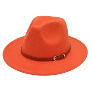 Detail of orange wool fedora hat featuring a brown faux leather band and gold metal buckle