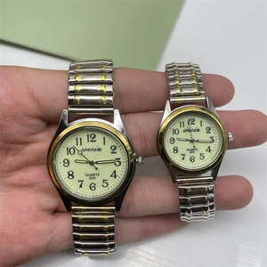 Detail shot of matching Wecin quartz watches with two-tone steel bands and large numerals