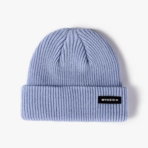 Light blue knit beanie featuring a vertical ribbed design and a black MTEESX logo patch