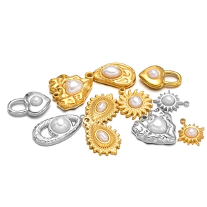 Stainless steel heart and sun pendants with pearl inlay in gold and silver finish