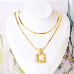 Double-layered gold-plated snake chain necklace featuring a textured square pendant