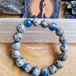 Bracelet zen en perles de pierre grise de style chinois pour hommes et femmes sur bois