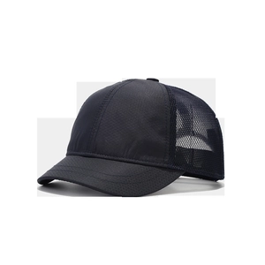 Detail of navy blue mesh baseball cap showing honeycomb texture and short brim fabric