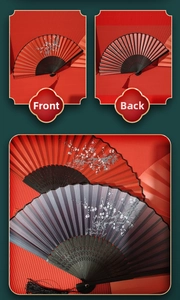 Detail of red folding fan with white plum blossom patterns and black tassel on red background