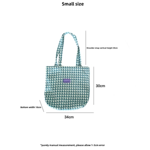 Size chart detail for wool plaid tote bag showing dimensions and strap height